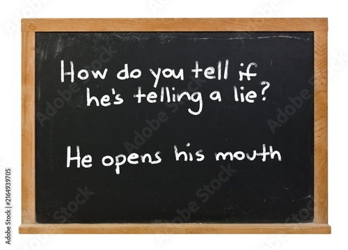 Cuadro en lienzo How do you tell if he's telling a lie? He opens his mouth written in white chalk