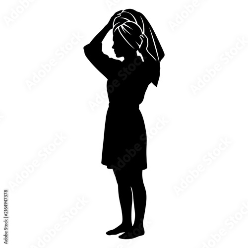 A striking black silhouette of a woman standing in profile, wearing a robe or dress and wrapping her wet hair in a towel after a shower or bath, isolated on white.