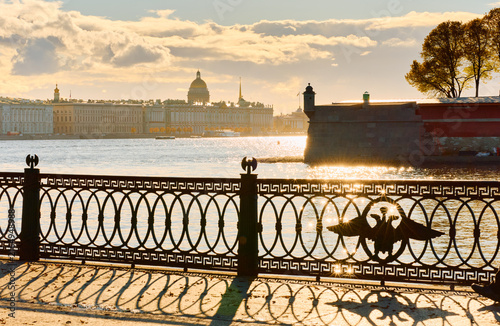 Konstfotografi Isaac cathedral, Winter Palace, picturesque metal railings with a double-headed eagle and the crown of the Russian Empire on embankment in St