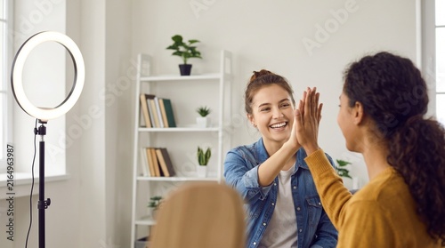 Young Content Creators Celebrating Successful Video Shoot, Behind The Scenes High Five In Modern Apartment, Authentic Digital Generation Teamwork, Copy Space