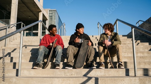 Skaters Relaxing On Concrete Stairs At Urban Meetup, Diverse Friends Sharing Street Culture Lifestyle, Plaza City Environment, Youth Connection, Copy Space