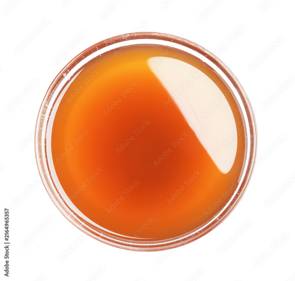Fototapeta premium Tasty maple syrup in glass bowl isolated on white, top view