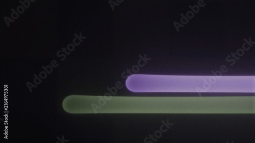 Two glowing tubes, one purple and one green, float against a dark background.