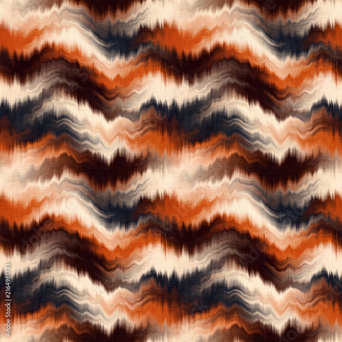 A seamless repeating background pattern featuring wavy, distorted tie-dye stripes in rich earthy shades of burnt orange, dark grey, and soft cream.