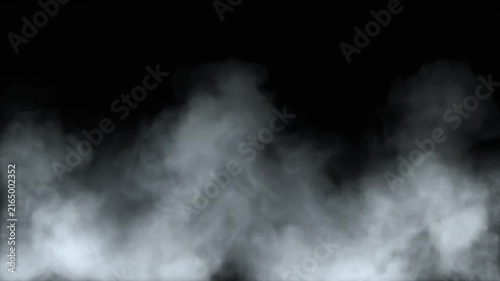 Thick white smoke rises against a dark black background creating an abstract cloudy texture.
