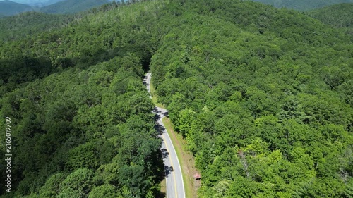 Panning up revelaing a road winding through Oconee State Park with the foothills in the background in northwest South Carolina.