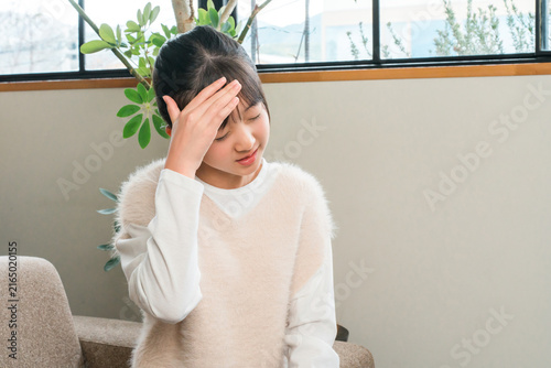 Canvastavla Elementary and middle school girls holding their heads due to headaches and fever
