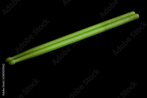 Glowing plastic drumsticks Isolated on black