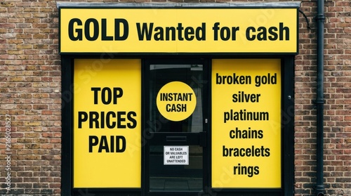 Storefront sign advertising gold and silver wanted for cash payment.
