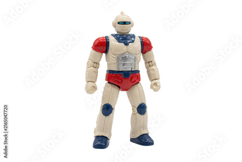 Retro style plastic robot toy with red shoulders, blue waist, and blue knee pads, isolated on a white background, for vintage toy collectors