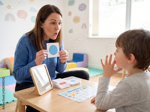 Speech therapist in a session with a young child