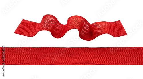 Vibrant red ribbon, a festive decorative element for gifts and celebrations. Elegant fabric ribbon, perfect for holiday packaging and craft projects. Luxurious red textile ribbon