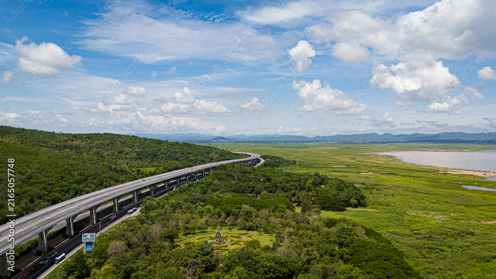 Fototapeta premium Drone shot The M6 motorway Nakhon Ratchasima Province - Bang Pa-in Lam Ta Khong River and Mountain. Motorway Korat Thailand