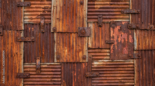Rusty Corrugated Metal Sheets with Bolts Full Frame Texture Background
