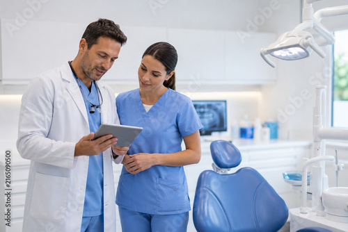 Dentist and Assistant Planning Patient Care