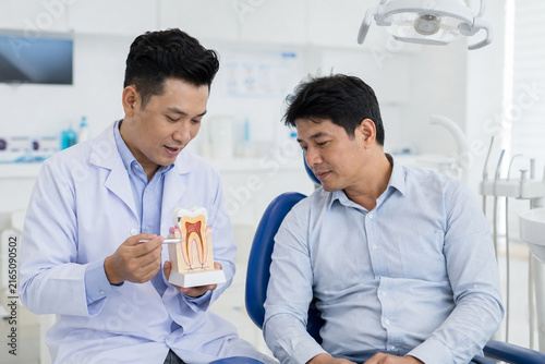 Dentist Explaining Checkup Results to Patient