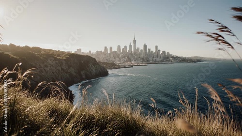 Coastal Cliffside Vista Overlooking City Skyline And Ocean.