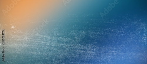 Obraz na plátně Warm orange to deep blue gradient background with grainy white texture and subtle distressing creates dynamic contrast for seasonal advertisements and professional header designs