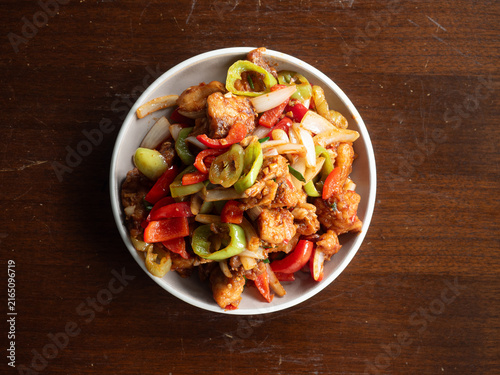 Canvas Print top view dish of stir fried fish fillet of grouper with garlic, onion, chili and