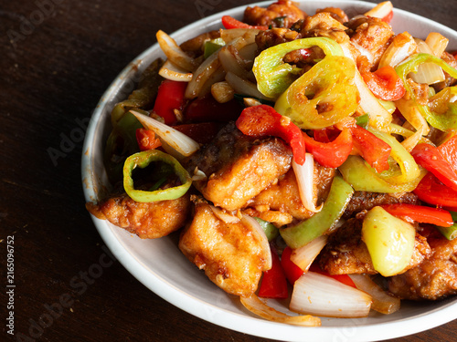 Canvas Print stir fried fish fillet with garlic, onion, chili and bell peppers