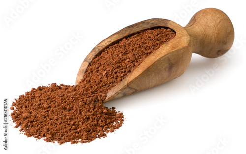 Raw cocoa powder in the wooden spoon, isolated on white background.