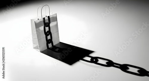 Conceptual minimalist image of a white shopping bag bound by a heavy black chain symbolizing consumerism and financial debt burdens