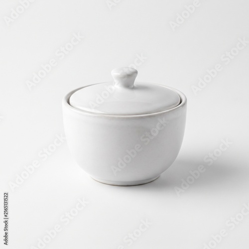 White ceramic sugar bowl with lid isolated on white background