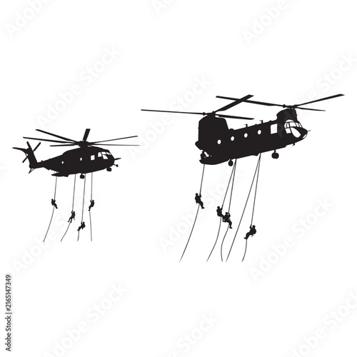 Картината върху платно Silhouettes of different military transport helicopters including a chinook and black hawk