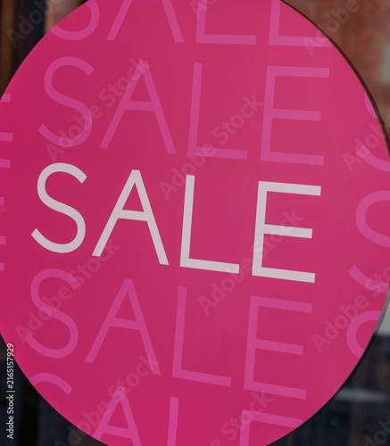 Pink sale sign in a Munich shop window