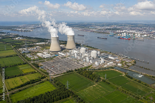 Aerial View of Nuclear Power Plant with Cooling Towers, River, Industrial Port and Farmland
