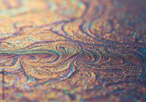 Iridescent Swirls of Cosmic Dust: A mesmerizing abstract macro shot captures the swirling patterns and iridescent shimmer of cosmic dust, evoking a sense of wonder and the vastness of the universe.