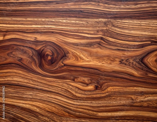 Close-up of richly textured dark brown wooden surface.