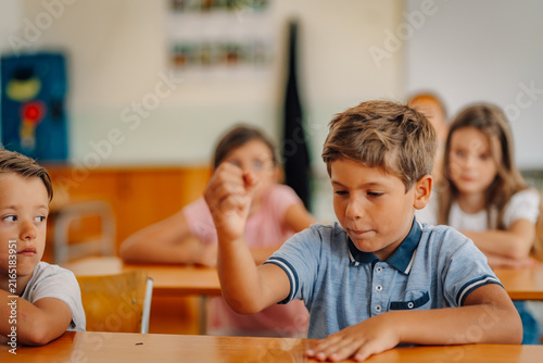 Obraz na płótnie Schoolboys concentrating on lesson during class