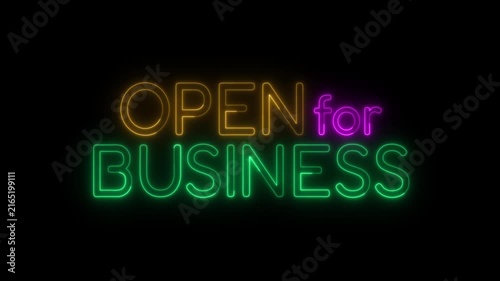Open for business neon sign flashing and glowing on black background video.