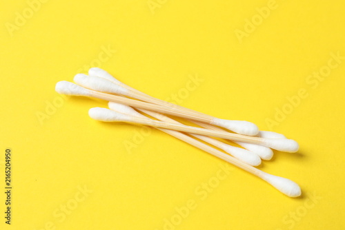 Cotton swabs on a colored background (top view)
