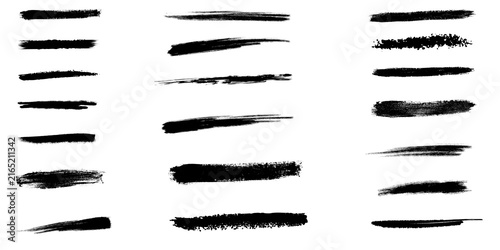 Set of various black ink brush strokes and paint textures for artistic design and graphic elements