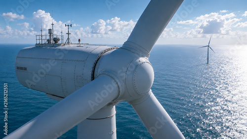 Aerial Close-Up of Offshore Wind Turbine Generating Renewable Energy Over the Ocean