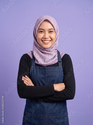 Woman wearing hijab crossing arms