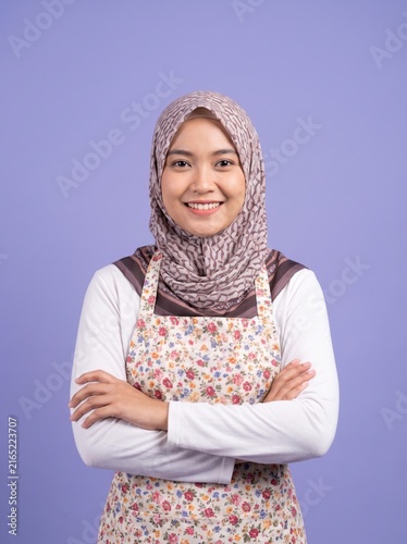 Woman wearing hijab crossing arms