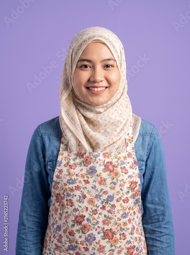 Woman wearing hijab crossing arms