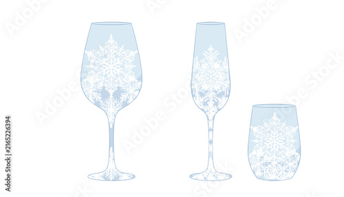Elegant set of crystal glassware featuring delicate white snowflake patterns perfect for festive winter holiday party and celebrations.