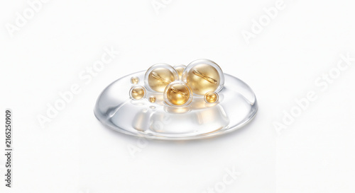 Macro shot of golden peptide capsules and hyaluronic beads in thick hydrating serum gel