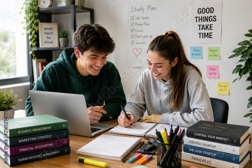 Young students studying together with laptop and notebooks in modern workspace