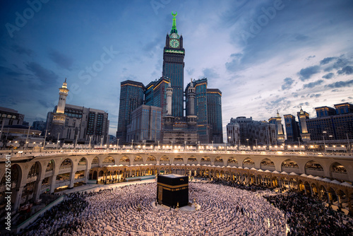 Photography Pilgrims surround the Kaaba at dusk creating a sea of devotion under the evening