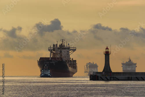 
MARITIME TRANSPORT - A bulk carrier is heading to port, and in the background two passenger ships