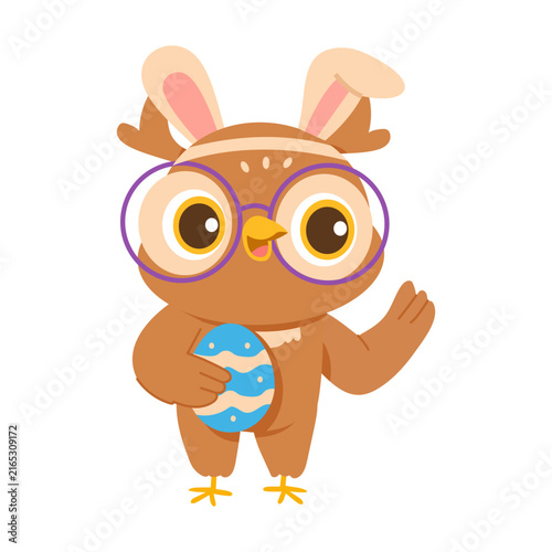 Картината върху платно A festive owl wearing bunny ears and holding an egg, ideal for Easter, spring, holiday, and seasonal designs