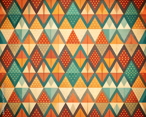Geometric pattern with triangular shapes and polka dots in warm. muted colors. Abstract design with a vintage aesthetic.