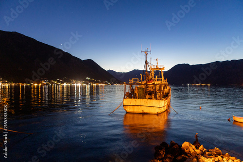 Fishing Boat Moored in Sea Bay at Night