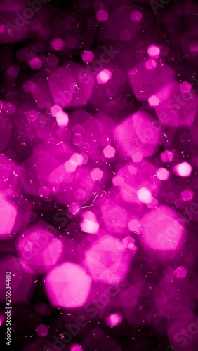 Abstract background featuring soft, out-of-focus hexagonal shapes in a rich magenta hue, creating a magical and festive atmosphere