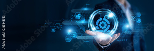 Businessman hand hold Agile and global networking data, managing flexible workflows, improving collaboration, accelerating software development, supporting continuous business improvement.